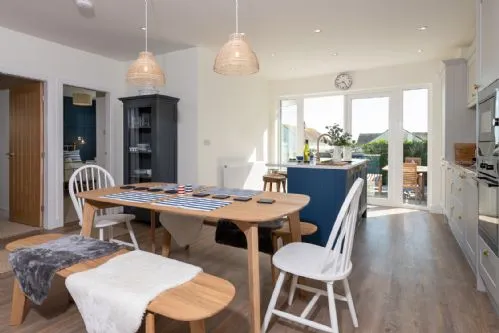 Off the Hook - Dining table and rear garden view