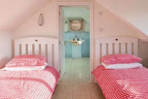 White Cottage Quad Room Pink Beds