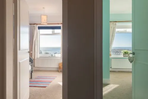 White Cottage Split View of Bedrooms