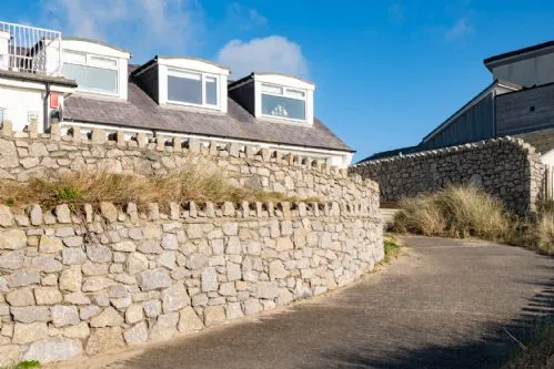 White Cottage Outside House at the Back
