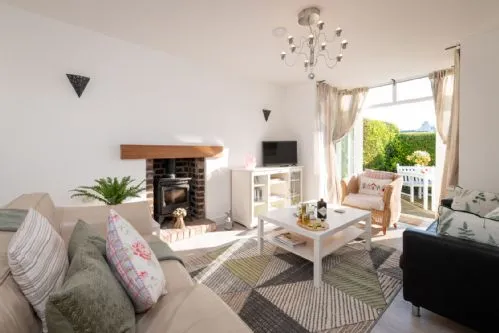 Lan Y Mor - living room ft. patio doors
