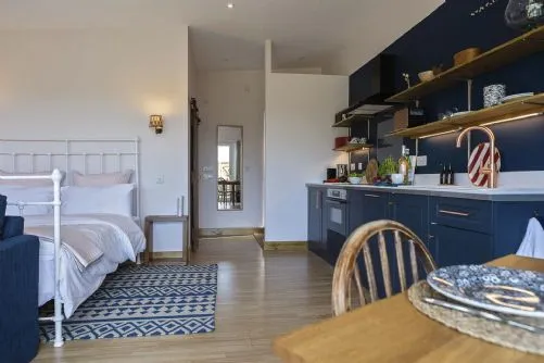 The Hoot - kitchen and bedroom