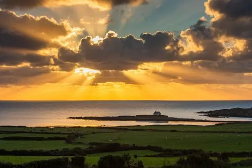 Sunset at church in the sea