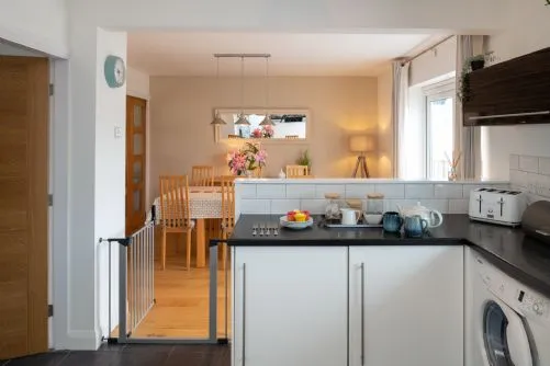 Cae Cloc kitchen with view to dining table