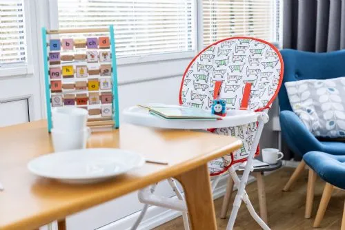Highchair at dining table in Tamarisk