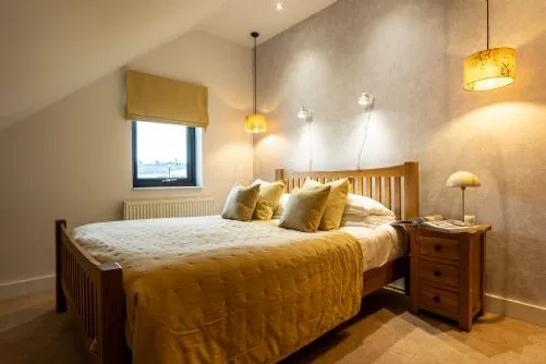 Porth Crigyll Double Bedroom with lights on