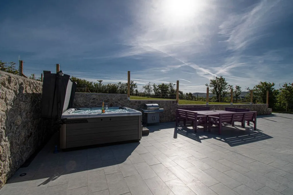Ty Rhos Newydd sunset over hot tub